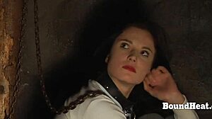 Gagged lesbian slave endures whipping from dominant madame