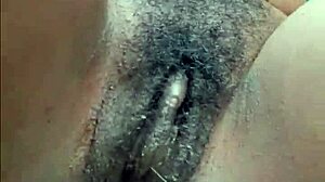 Horny ebony woman pisses publicly in wet outdoor spot