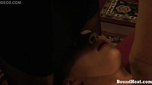 Putting slave mark on her pussy in femdom bondage