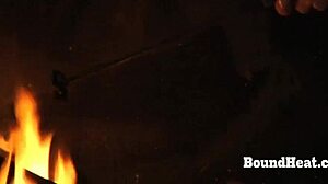 Putting slave mark on her pussy in femdom bondage