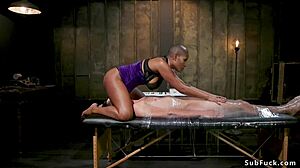 Ebony dom anal fucks man in straitjacket