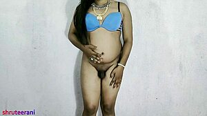 An Indian shemale in a blue bikini crossdresses and indulges in anal pleasures during part five of the series.