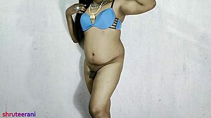 An Indian shemale in a blue bikini crossdresses and indulges in anal pleasures during part five of the series.