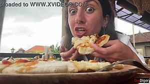 Girl with cum on face eats pizza in cafe
