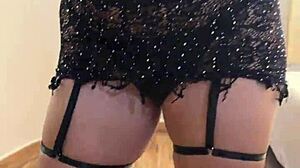 A beautiful Latina dances in lingerie and costumes at home, feeling sexy