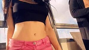 Hot pornstar Sasha Rose dances a seductive striptease outdoors