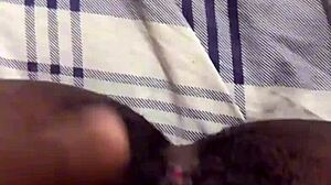 Black amateur engages in solo pussy play with masturbation, reaching wet orgasm