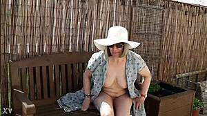 Naughty girl strips naked in the garden, feeling free outdoors.