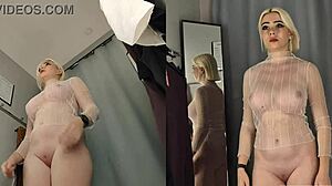 Naked blonde teases with big tits in transparent fitting room try-on