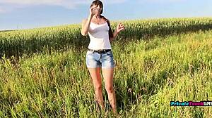 horny russian girl inserts bottle into wet pussy outdoors, feeling every inch deeply