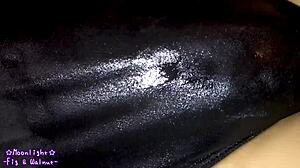 Watch me slip into this dark blue swimsuit with lotion for a slippery feel.