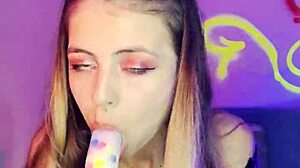 watch this tiny blonde babe seduce with her pierced nipples and dildo play