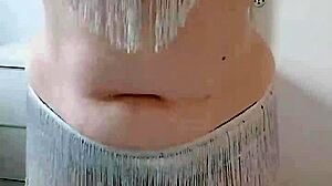 A BBW with a big ass performs an enticing belly dance on stage