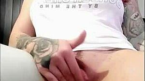 brunette rubs clit while watching porn to orgasm