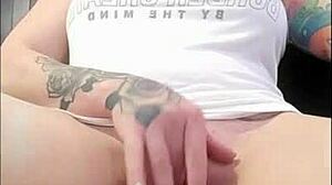 brunette rubs clit while watching porn to orgasm