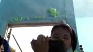 I watch an Indonesian teen girl bathing on webcam, feeling relaxed.