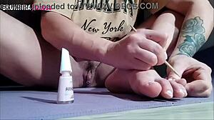 brazilian hottie paints toenails close-up flashing shaved pussy and toes to tease