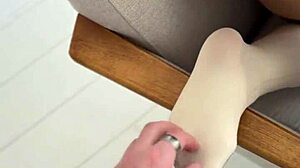 girl toys with her nylon covered feet