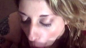 Hot milf drops to her knees before her husband, wrapping lips around his throbbing cock and sucking hungrily until he explodes