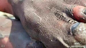 goddess hikes up leggings to reveal her dirty torn pantyhose nylon feet toes close up by the river