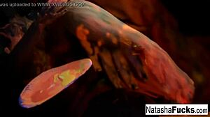 Busty brunette Natasha Nice masturbates sexy in black light