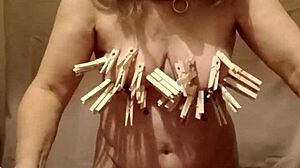 French maid slave bound bent over with nipple clamps and belt for outdoor humiliation