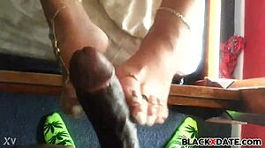 Excellent Black Babe Teases with Homemade Footjob in HD