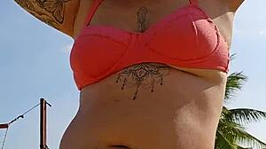 Filming beach video flashing to tease african males nearby