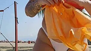 Filming beach video flashing to tease african males nearby