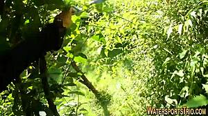 Outdoor lesbians in stockings finger and toy each other with golden shower fetish