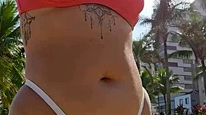 Filming beach video flashing to tease african males nearby