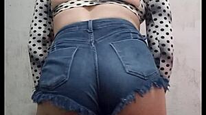 a sexy latina trans rebolando her ass in tight shorts