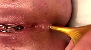 hey, check out this milf slipping gold heels into her ass while fingering that juicy hole