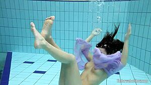 whoa aneta's big tits look epic in that purple dress underwater pool play