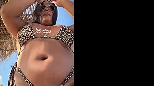 married prostitute shows off huge tanned ass with bikini wedged deep in cheeks