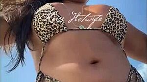 married prostitute shows off huge tanned ass with bikini wedged deep in cheeks