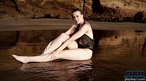 German milf bombshell Jasmin Furry strips furry pussy on beach for Playboy centerfold